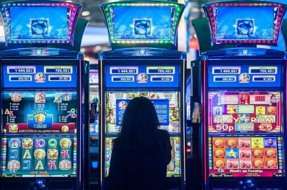 someone playing slot machines in a live casino